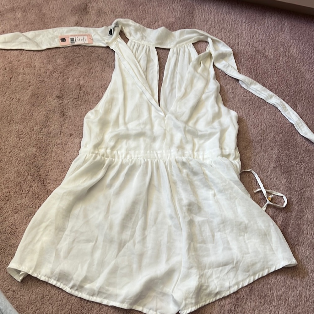 White shopow romper- never been worn size 08 but runs small